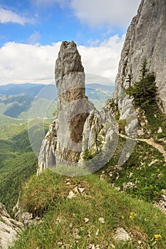 Majestic rock tower in mountains,Piatra Craiului mountains,Carpathians,Romania photo