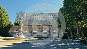 Majestic Royal Palace of Madrid, Panoramic view of the Royal Palace of Madrid with tourists in the foreground.