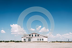 Majestic shot of a modern whitewashed rural house under a beautiful cloudscape