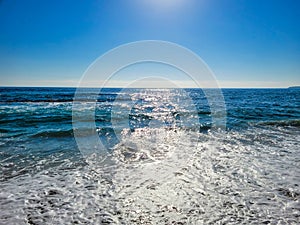 A majestic shot of vast miles of gorgeous blue ocean water with blue sky at Treasure Island Beach in Laguna Beach California