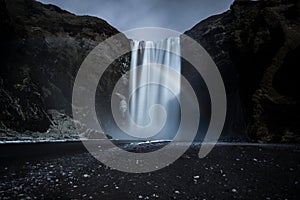 The majestic Skogafoss waterfall and a rainbow in Iceland