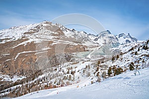 Majestic snow covered mountain range against blue sky in alps
