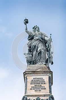 Majestic Statue of Germania Overlooking the Niederwald Landscape in Germany on a Clear Day photo