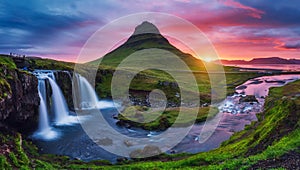 Majestic sunrise with Kirkjufell volcano the coast of Snaefellsnes peninsula. Location place Kirkjufellsfoss waterfall, Iceland,