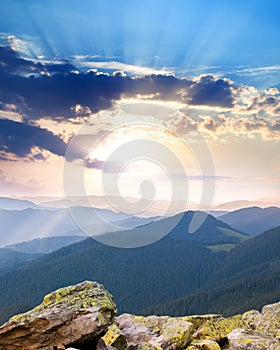 Majestic Sunrise over the mountains with sunbeams - vertical