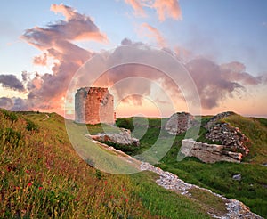 Majestic sunset and ancient fortress ruin