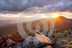 Majestic sunset in the mountains landscape. Dramatic sky and col