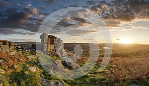 Majestic sunset over landscape of Leather Tor in Dartmoor during Summer with dramatic sky