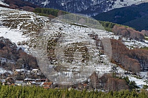 Majestic view of cloudy sky, winter mountain, snowy glade, residential district, conifer and deciduous forest from Plana mountain