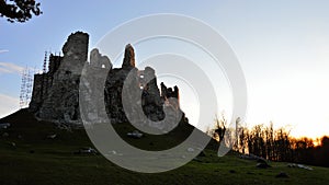 Majestic view of gothic castle Hrusov, central Slovakia, from northern side, sunbathing in evening winter sunshine.