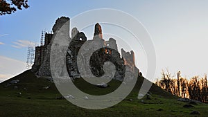 Majestic view of gothic castle Hrusov, central Slovakia, from northern side, sunbathing in evening winter sunshine.