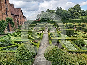 A majestic view of Hatfield House in Hertfordshire towering over manicured lawns and gardens