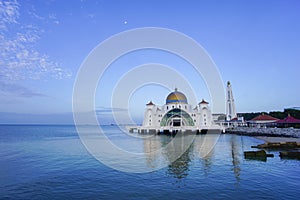 Majestic view of Malacca Straits Mosque during blue hour.