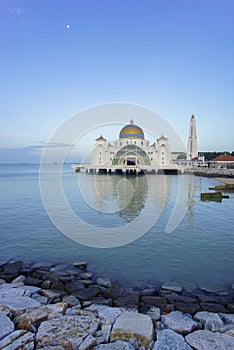 Majestic view of Malacca Straits Mosque during blue hour.