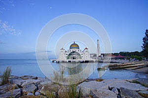 Majestic view of Malacca Straits Mosque during blue hour.