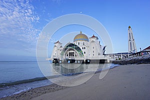 Majestic view of Malacca Straits Mosque during blue hour.