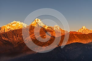 Majestic view of sunset sweeping through Annapurna South and Himchuli from Poon Hill, Ghorepani, Nepal