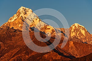 Majestic view of sunset sweeping through Annapurna South and Himchuli from Poon Hill, Ghorepani, Nepal