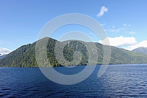 Majestic views of the forested mountains and beautiful blue ocean along the british columbia coast