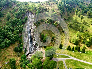 Majestic water cascade of Powerscourt Waterfall, the highest waterfall in Ireland. Tourist atractions in co. Wicklow, Ireland photo