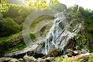 Majestic water cascade of Powerscourt Waterfall, the highest waterfall in Ireland.