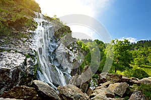 Majestic water cascade of Powerscourt Waterfall, the highest waterfall in Ireland.