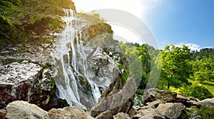 Majestic water cascade of Powerscourt Waterfall, the highest waterfall in Ireland. Tourist atractions in co. Wicklow, Ireland