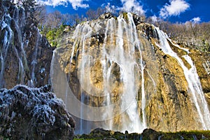 Majestic waterfall cascading down a rocky mountainside, Plitvice National Park, Croatia