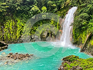 Majestic waterfall in the rainforest jungle of Costa Rica. Tropical hike