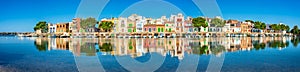 Majorca Spain, colorful houses of old fishing harbor village of Porto Colom, panorama view