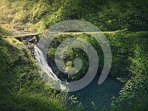 Makapipi Falls of Maui, the Road to Hana in Hawaii. Beautiful waterfall underneath the highway bridge. Wonderful cascade in the in