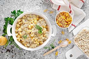 Makaroni po-flotski. Boiled pasta in navy-style with ground chicken meat and fried onions