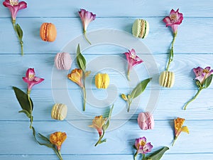 makaroon on blue wooden alstroemeria greeting