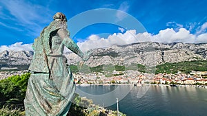 Makarska - Statue of Saint Peter on peninsula overlooking coastal town Makarska, Split-Dalmatia, Croatia, Europe