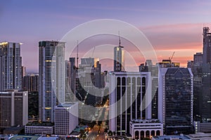 Makati avenue and city skyline at sunset. Cityscape of Makati, Metro Manila, Philippines