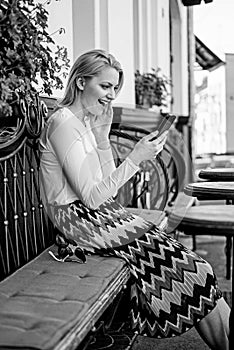 Make appointment. Woman enthusiastic face with smartphone create appointment in social network and wait friends cafe
