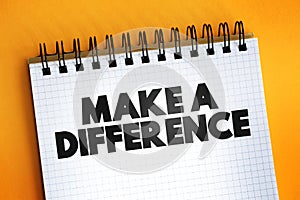 Make A Difference text quote on notepad, concept background