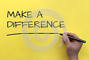 Make a difference text on yellow cover background. Copy space and make a difference concept