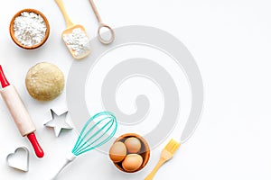 Make dough. Ingedients flour, eggs near cookware on white background top view copy space