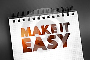 Make It Easy text on notepad, concept background