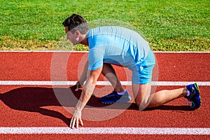 Make effort for victory. Runner ready to go. Adult runner prepare race at stadium. How to start running. Sport tips from