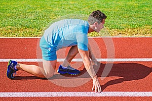 Make effort for victory. Runner ready to go. Adult runner prepare race at stadium. How to start running. Sport tips from