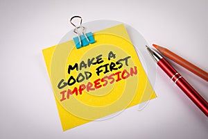 Make a Good First Impression. Notepad with text on white table