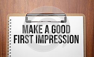 Make a good first impression text on white paper on the wood table