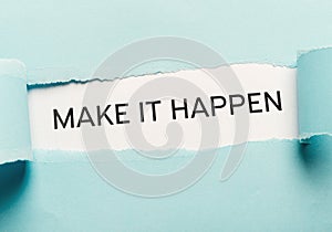 Make it happen phrase bursting out from torn blue paper