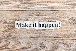 make it happen text on paper. Word make it happen on torn paper. Concept Image