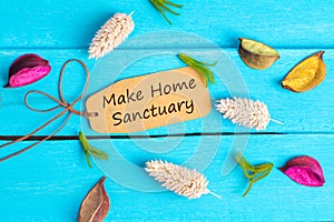 Make home sanctuary text on paper tag photo
