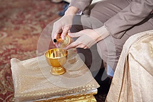 Make merit in the buddhist ceremony in Thai Traditional Wedding