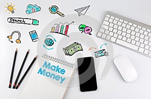 Make Money. Office desk table with computer, Smartphone, note pad, pencils