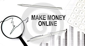MAKE MONEY ONLINE text on document with pen,graph and magnifier,calculator